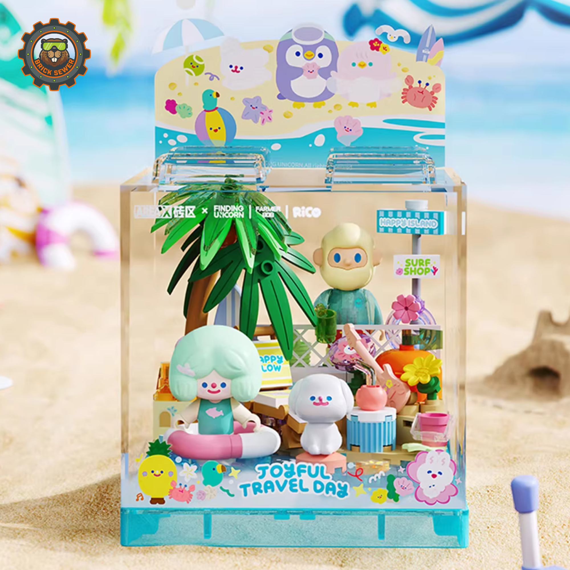 Rico & Bob - Travel Day display cube featuring characters enjoying a sunny beach with coconut trees and playful sea creatures.