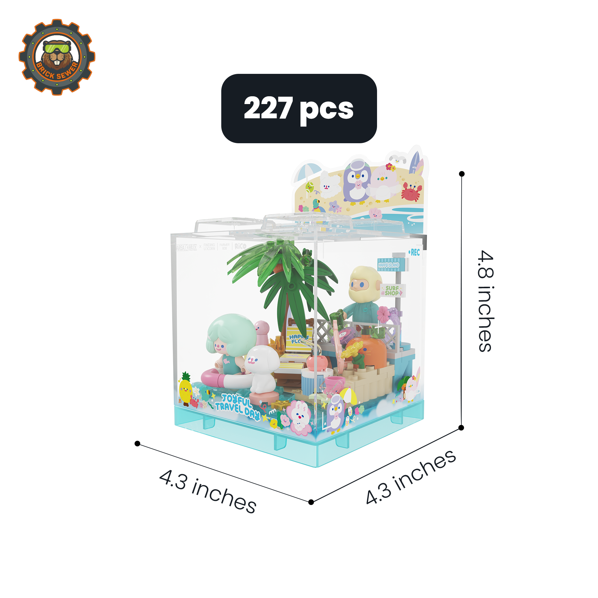 Rico & Bob - Travel Day display cube with beach scene, palm trees, and playful sea creatures, perfect for a sunny escape.